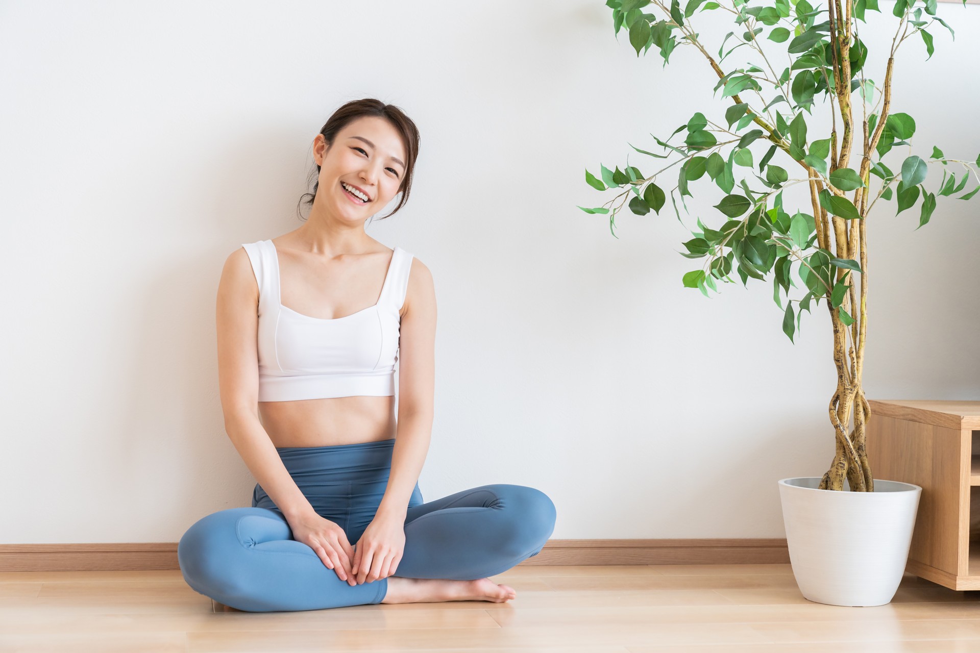 young asian woman exercising in the room